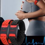 Bluetooth ANT+ heart rate arm band on runner's arm during workout
