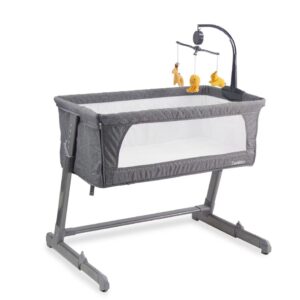 Adjustable bedside bassinet with 5-position height adjustment next to bed